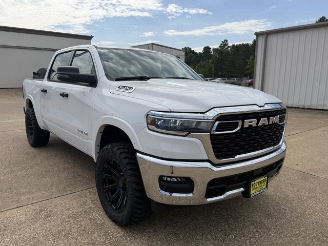 2026 RAM Ram 1500 RAM 1500 LONE STAR CREW CAB 4X4 5'7' BOX in Bright White Clear-Coat Exterior Paint — front three-quarter view