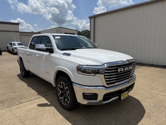 2026 RAM Ram 1500 RAM 1500 LARAMIE CREW CAB 4X4 5'7' BOX in Bright White Clear-Coat Exterior Paint — front three-quarter view
