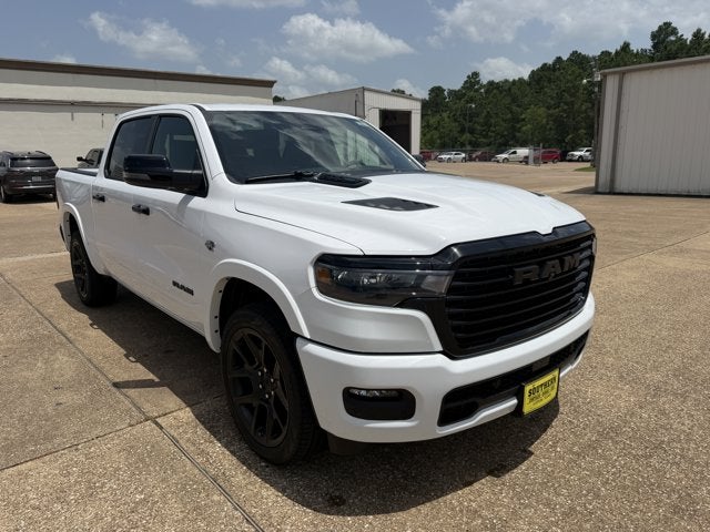 2026 RAM Ram 1500 RAM 1500 LARAMIE CREW CAB 4X4 5'7' BOX in Bright White Clear-Coat Exterior Paint — front three-quarter view