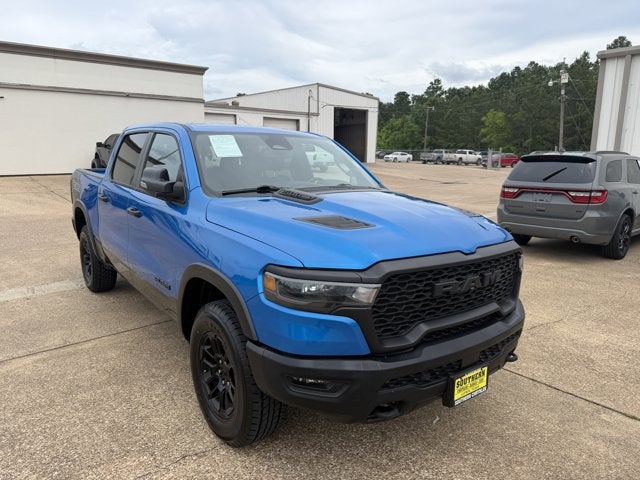2025 RAM 1500 Rebel Crew Cab 4x4 5'7' Box in Hydro Blue Pearlcoat — front three-quarter view