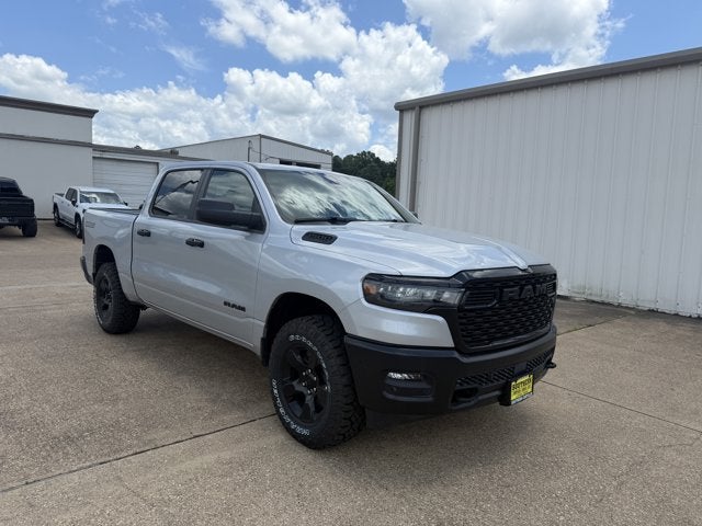 2026 RAM Ram 1500 RAM 1500 WARLOCK CREW CAB 4X4 5'7' BOX in Silver Zynith Exterior Paint — front three-quarter view